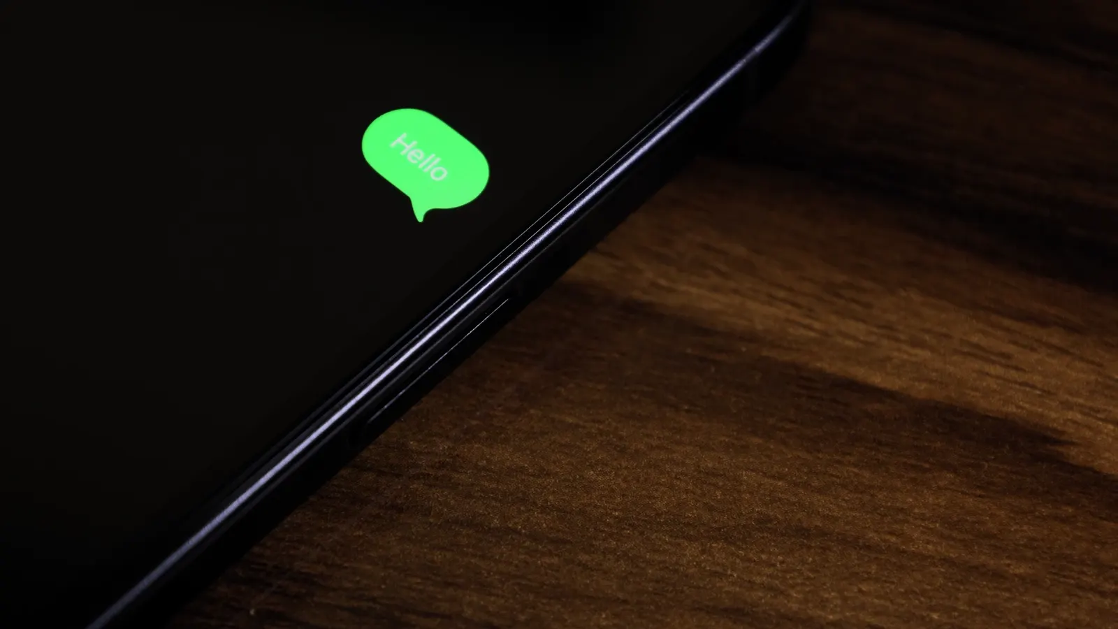 A phone on a desk lighting up
